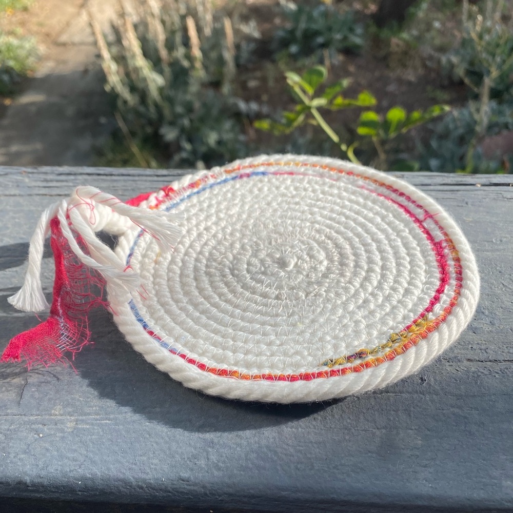 Handmade Cotton Rope Coaster. Mostly white, pink and blue added on the edges.